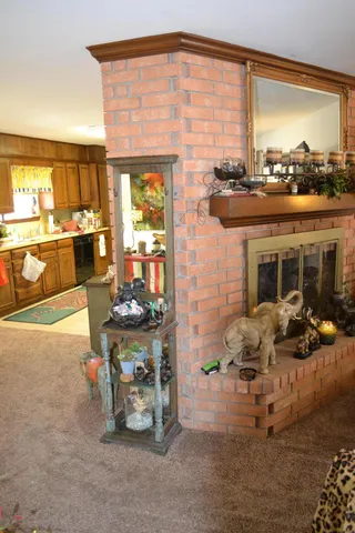 a dining room with furniture and a floor to ceiling window