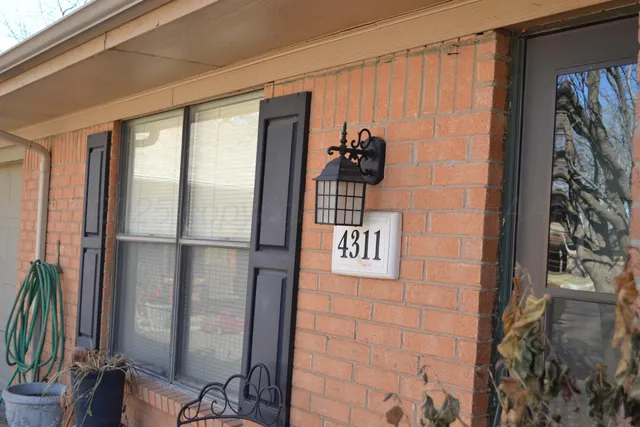 a bathroom with a shower and a sink