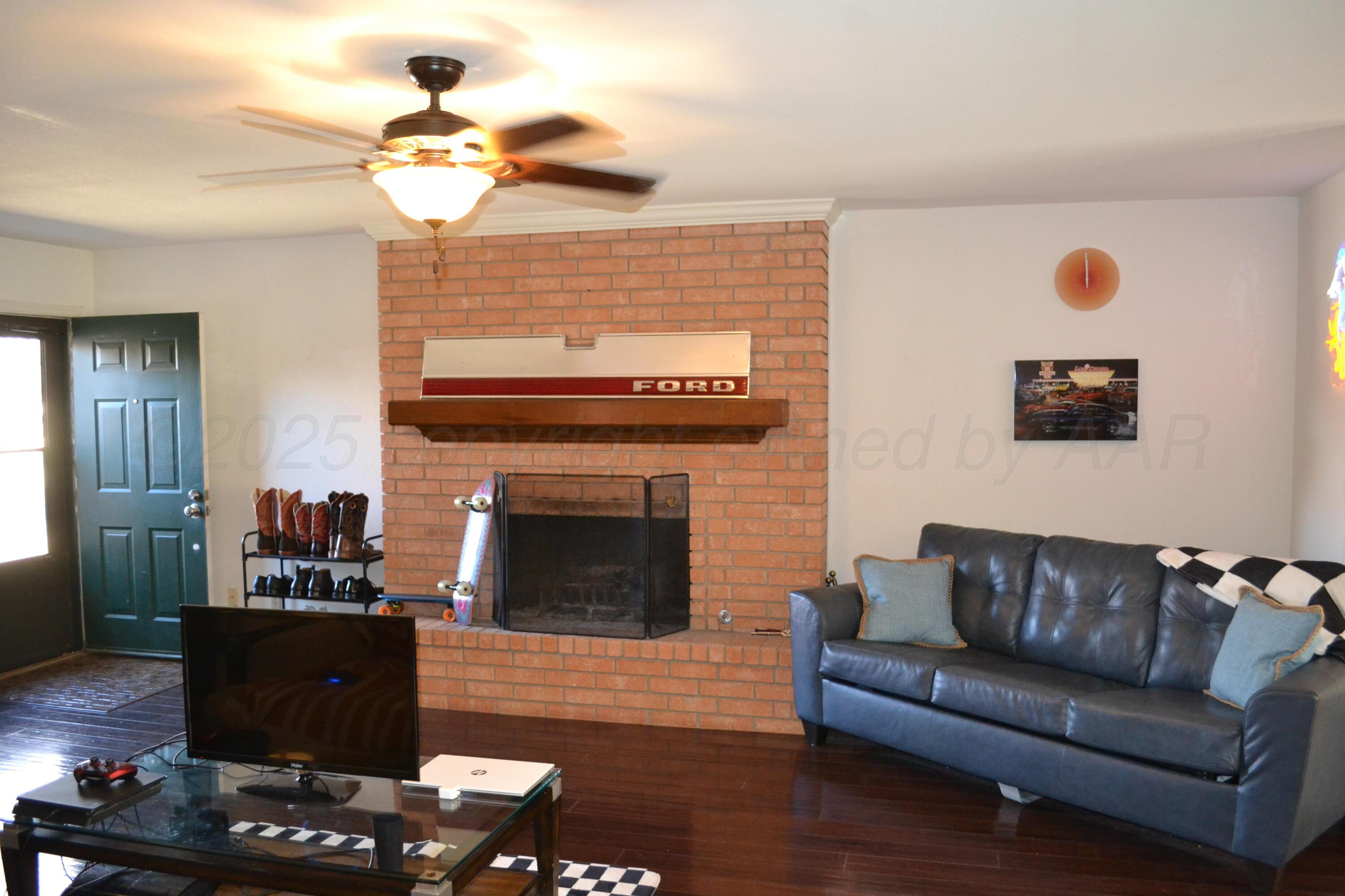 4307-4311 West 2nd Street Plainview, TX 79072 - Photo 46 of 51 a living room with furniture and a fireplace