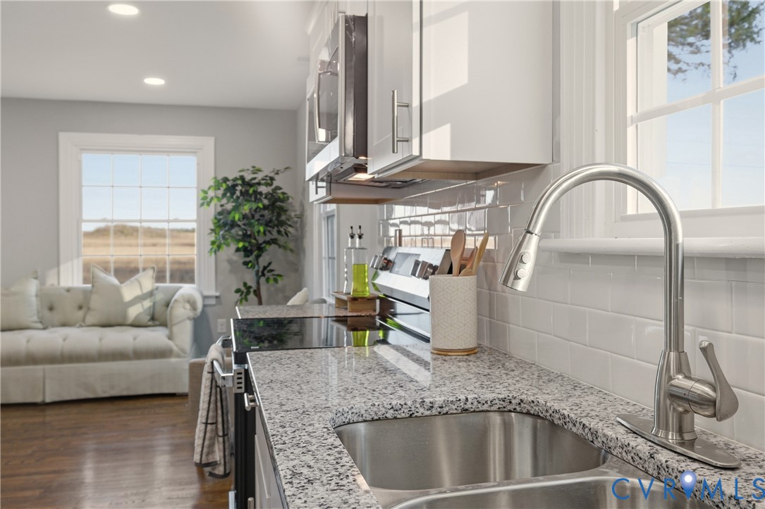 6280 Monahan Road Henrico, VA 23231 - Photo 21 of 42 a living room with furniture and a fireplace