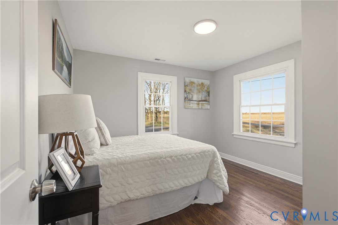 6280 Monahan Road Henrico, VA 23231 - Photo 23 of 42 a bedroom with a bed and wooden floor