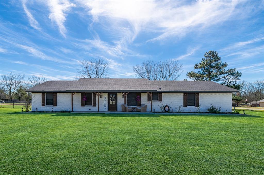 19 43040th Powderly, TX 75473 - Photo 1 of 21 a view of a house with a yard and large trees