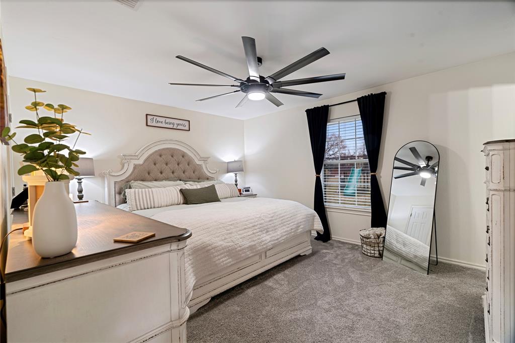 19 43040th Powderly, TX 75473 - Photo 16 of 21 a bedroom with a bed and ceiling fan