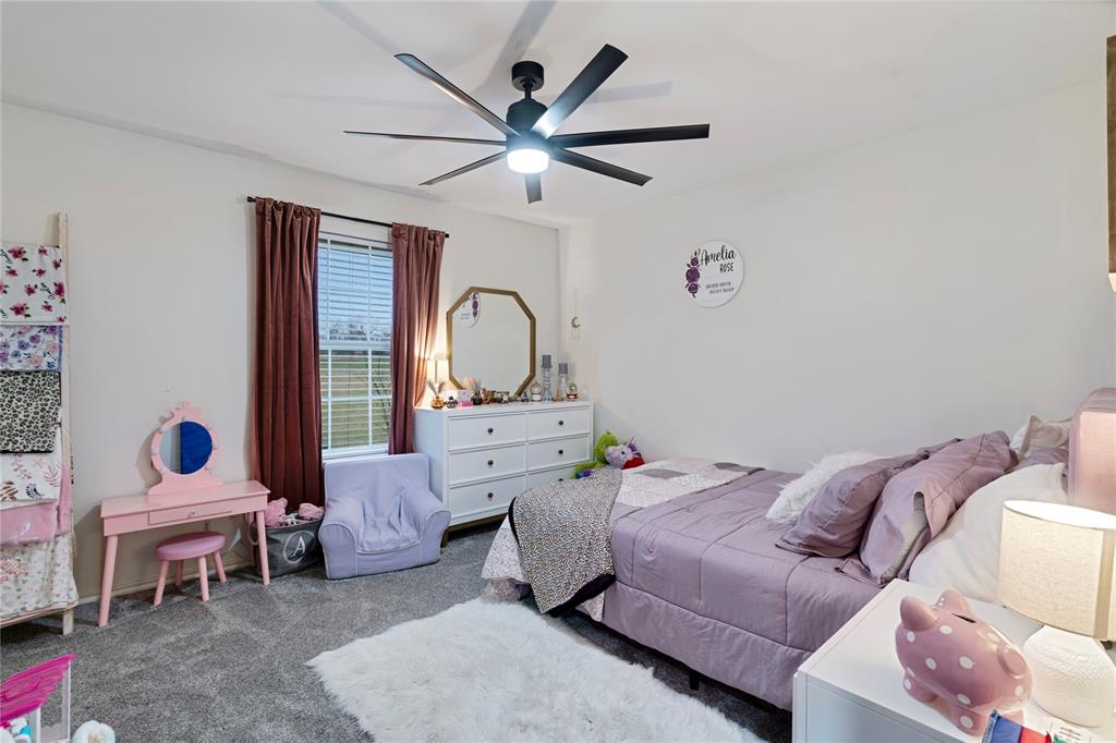 19 43040th Powderly, TX 75473 - Photo 18 of 21 a bed room with a bed and a mirror