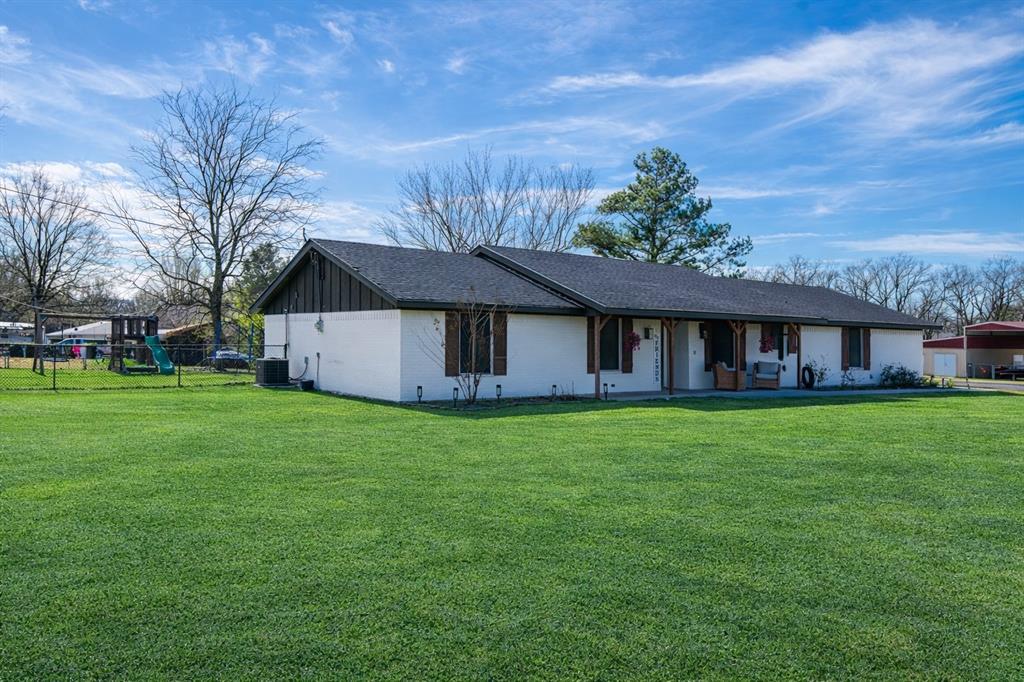 19 43040th Powderly, TX 75473 - Photo 2 of 21 a backyard of a house with a garden and deck