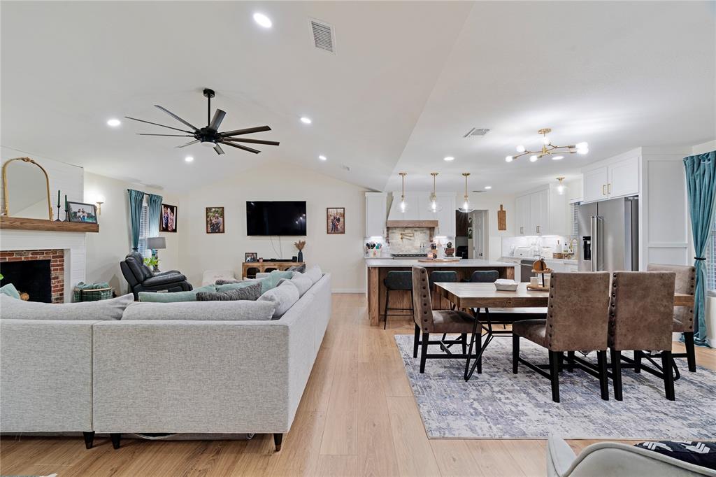 19 43040th Powderly, TX 75473 - Photo 9 of 21 a living room with furniture a flat screen tv and kitchen view