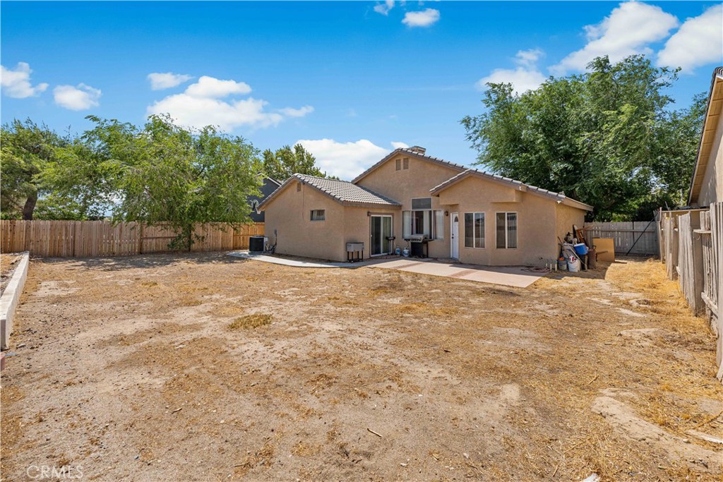 4331 Avoca Avenue Palmdale, CA 93552 - Photo 13 of 17 a front view of a house with a yard