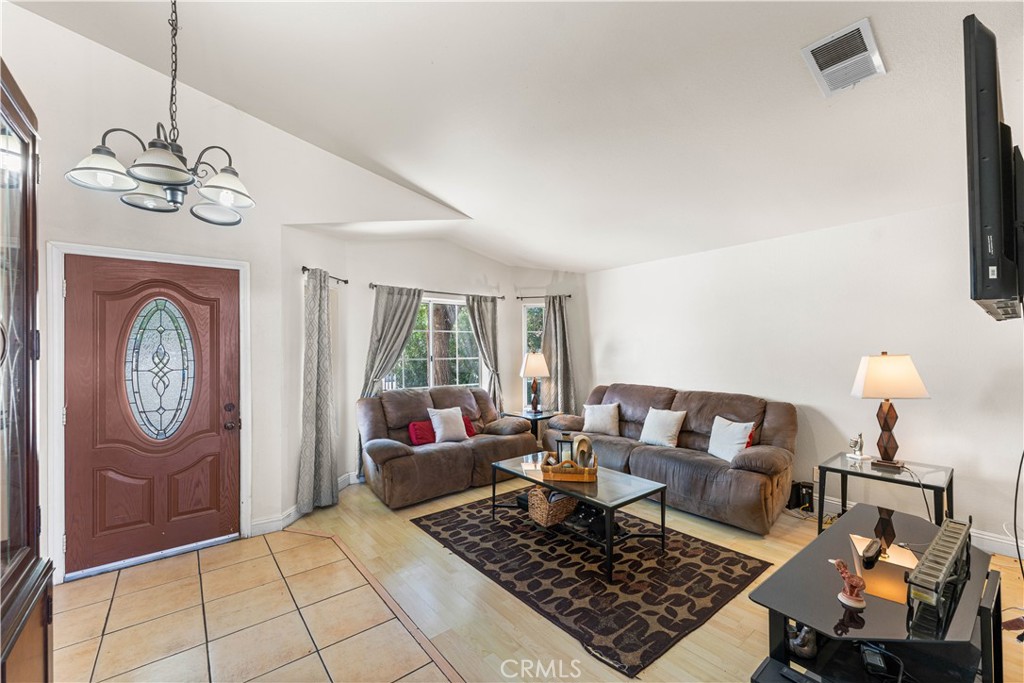 4331 Avoca Avenue Palmdale, CA 93552 - Photo 3 of 17 a living room with furniture and a window