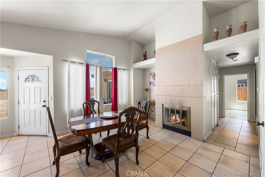 4331 Avoca Avenue Palmdale, CA 93552 - Photo 5 of 17 a view of a livingroom with furniture and a fireplace