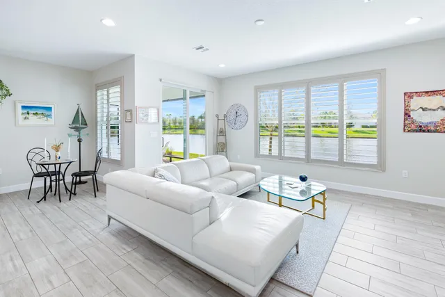 a view of swimming pool with an outdoor seating