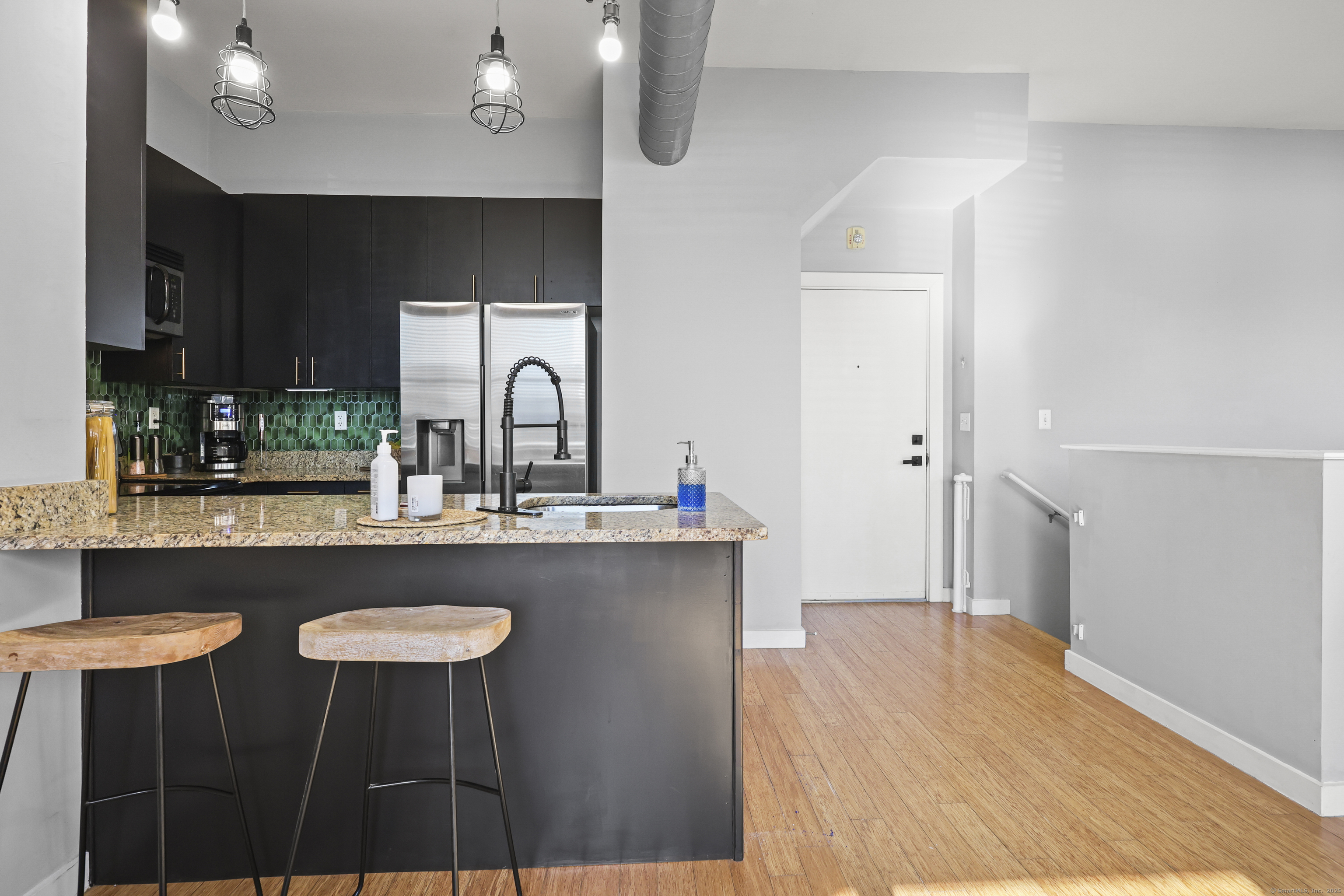 881 Lafayette Boulevard, Unit 1A Bridgeport, CT 06604 - Photo 14 of 37 a kitchen with kitchen island a sink stainless steel appliances and cabinets