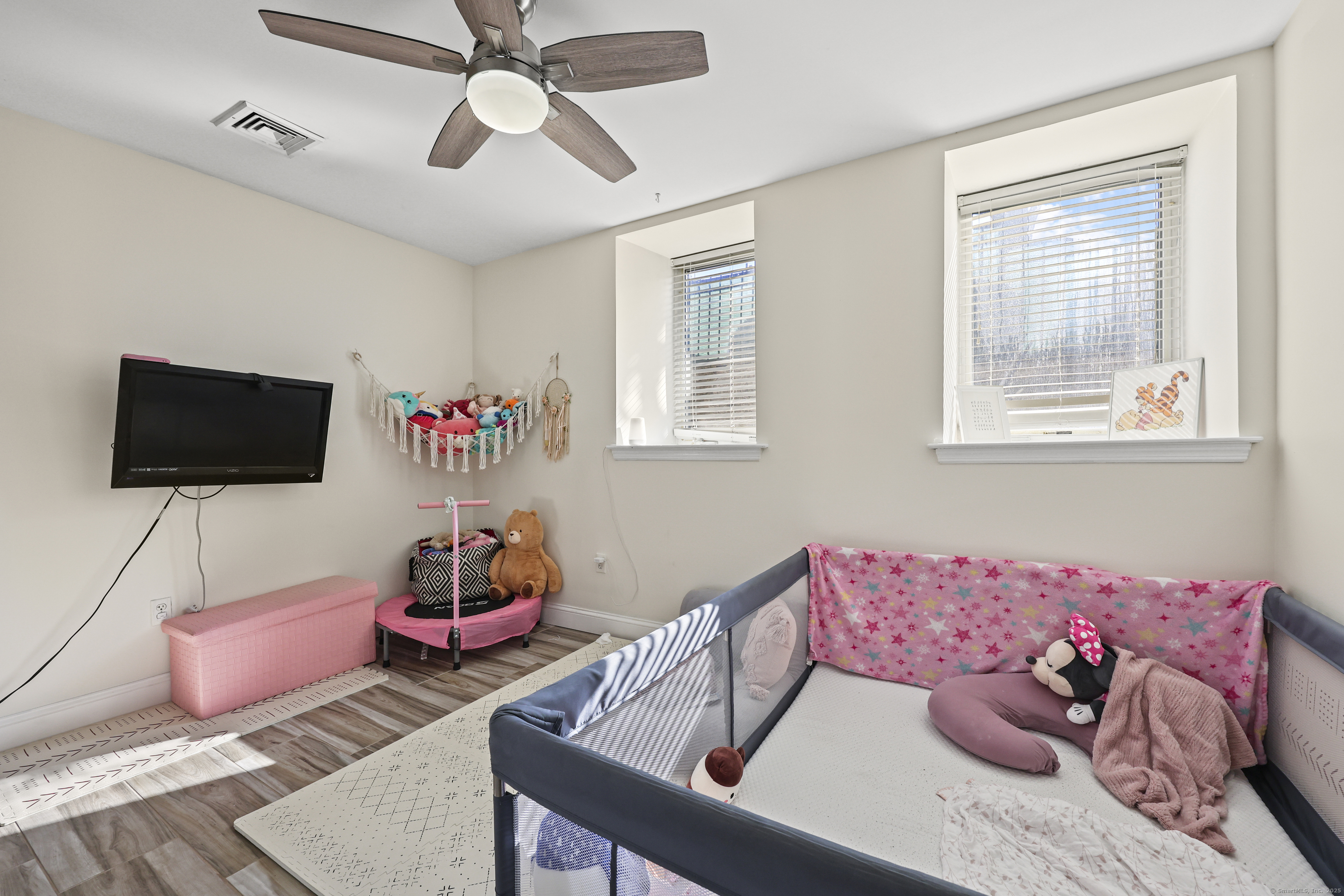 881 Lafayette Boulevard, Unit 1A Bridgeport, CT 06604 - Photo 24 of 37 a living room with furniture and a flat screen tv