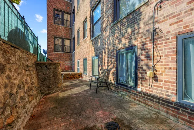 a view of a brick house with a street