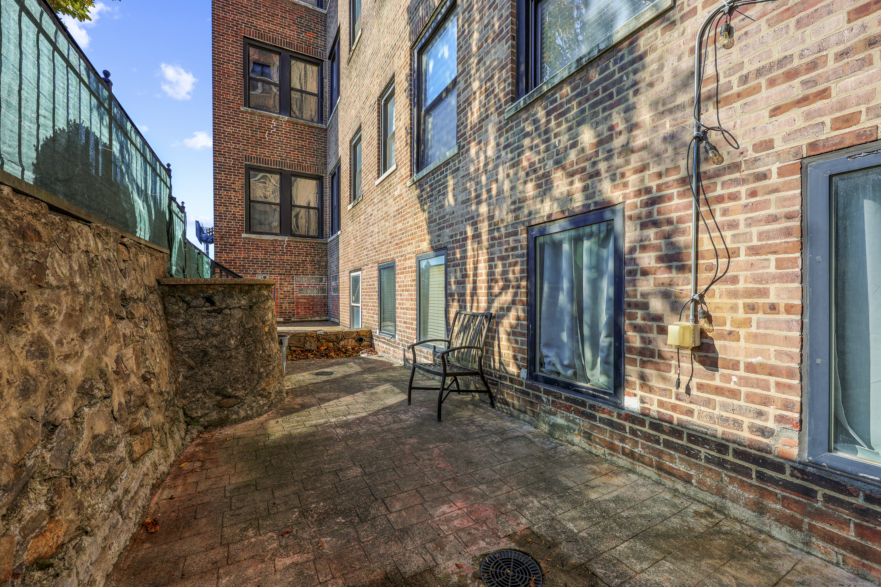 881 Lafayette Boulevard, Unit 1A Bridgeport, CT 06604 - Photo 33 of 37 a view of a brick building with many windows