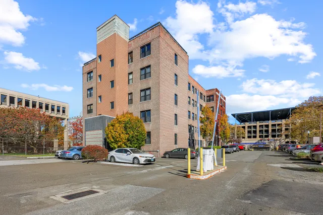 a view of a street with cars
