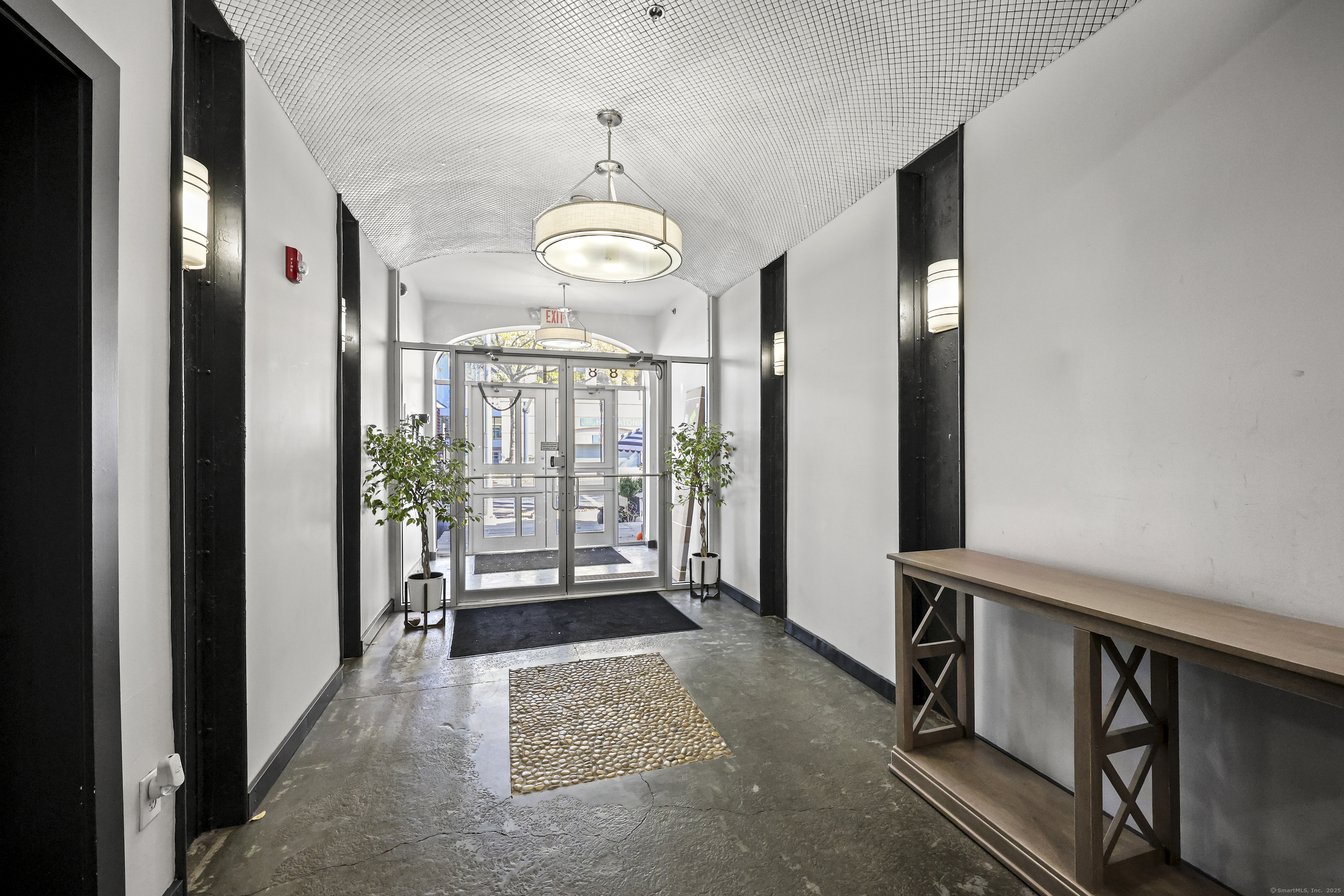 881 Lafayette Boulevard, Unit 1A Bridgeport, CT 06604 - Photo 7 of 37 a view of a room with furniture wooden floor and chandelier