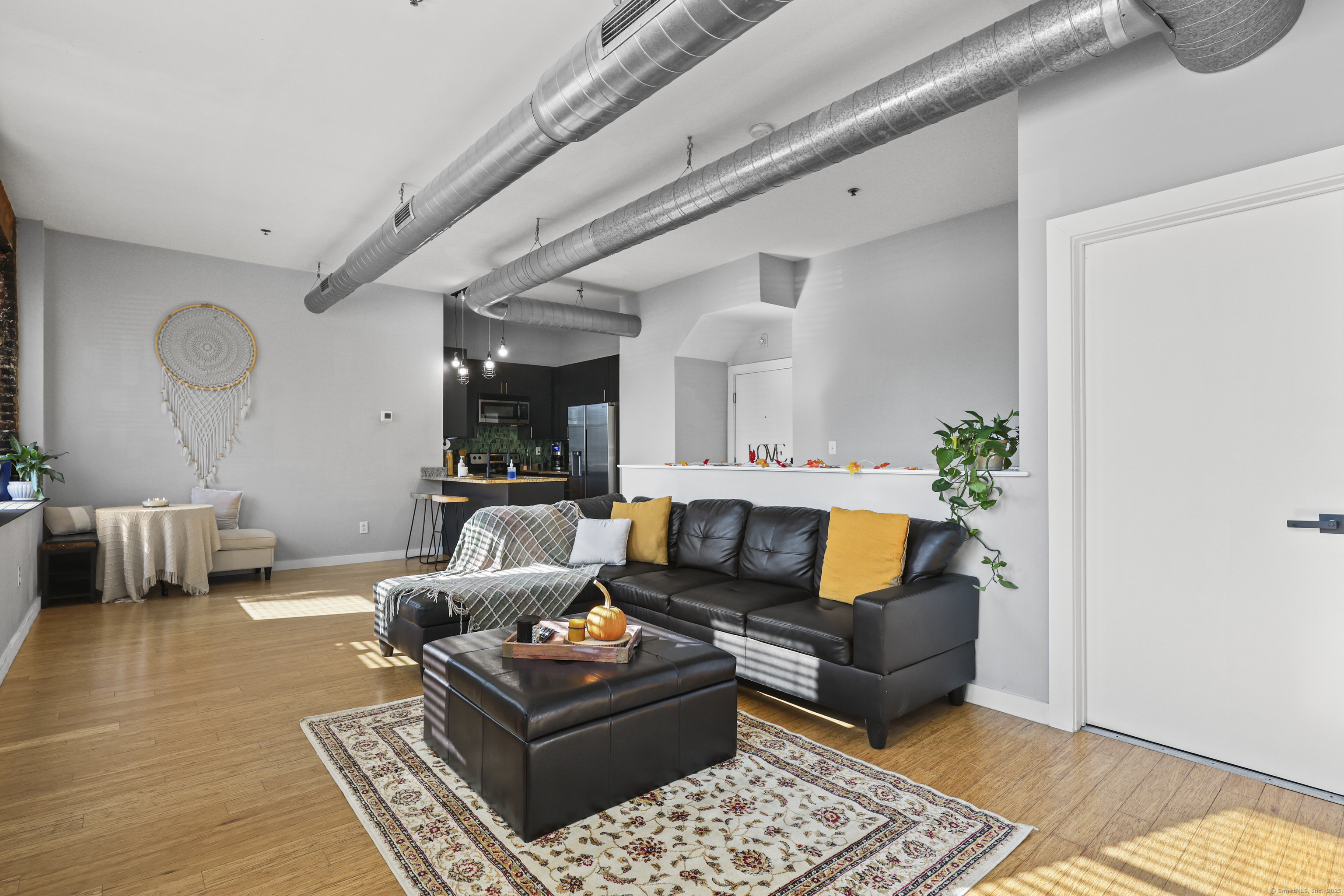 881 Lafayette Boulevard, Unit 1A Bridgeport, CT 06604 - Photo 10 of 37 a living room with furniture and wooden floor