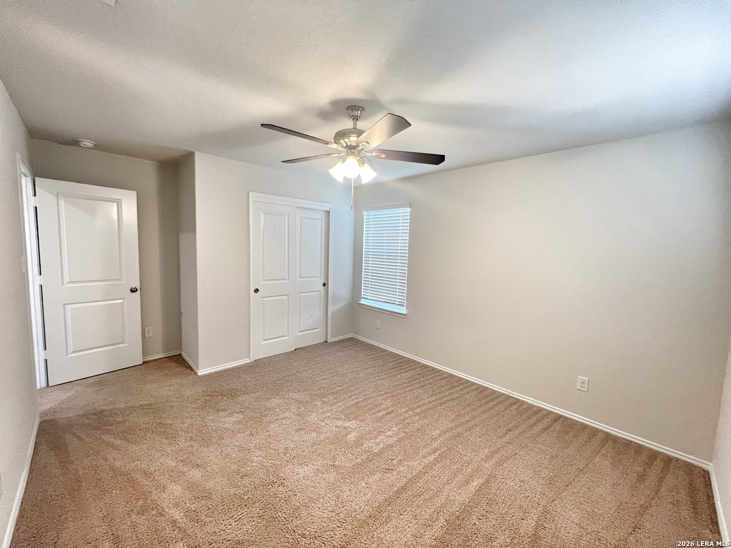 29529 Spring Copper Bulverde, TX 78163 - Photo 25 of 41 an empty room with chandelier fan and windows