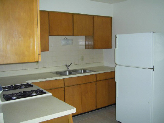 1805 South Alpine Road Rockford, IL 61108 - Photo 2 of 6 a kitchen with a sink a stove and a refrigerator