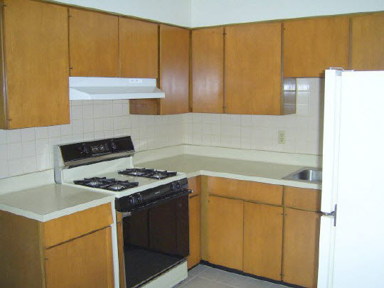 1805 South Alpine Road Rockford, IL 61108 - Photo 3 of 6 a kitchen with a sink a stove cabinets and a wooden floor