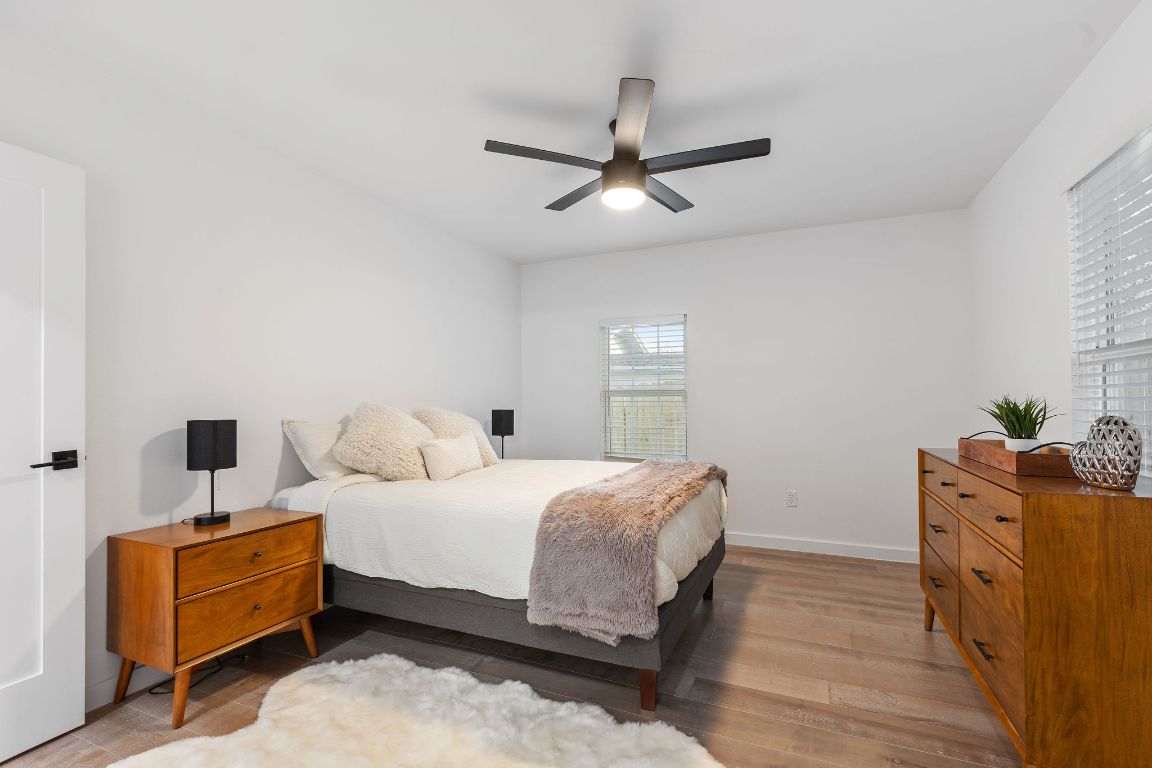 3004 Webberville Road, Unit 1 Austin, TX 78702 - Photo 5 of 12 a bedroom with a bed and a dresser