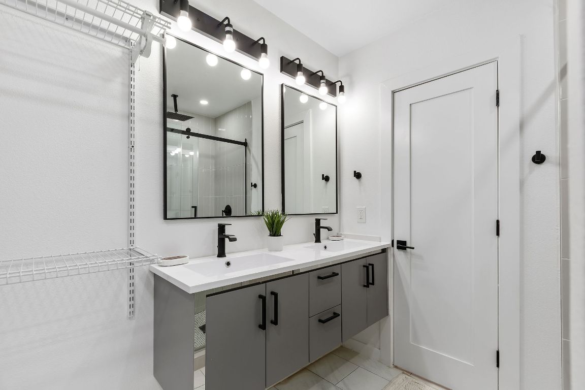 3004 Webberville Road, Unit 1 Austin, TX 78702 - Photo 6 of 12 a bathroom with a double vanity sink mirror and double