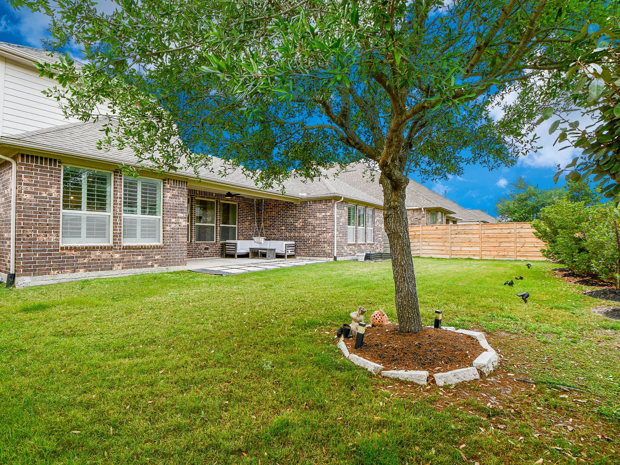 4523 Juniper Ridge Lane Manvel, TX 77578 - Photo 33 of 38 a front view of a house with a yard and garage