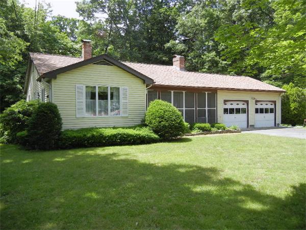 21 State Road Whately, MA 01373 - Photo 1 of 23 a front view of a house with a garden