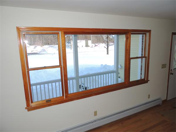 21 State Road Whately, MA 01373 - Photo 12 of 23 an empty room with wooden floor and windows