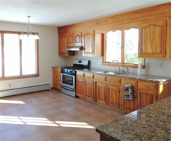 21 State Road Whately, MA 01373 - Photo 3 of 23 a kitchen with stainless steel appliances granite countertop a stove a sink and a microwave