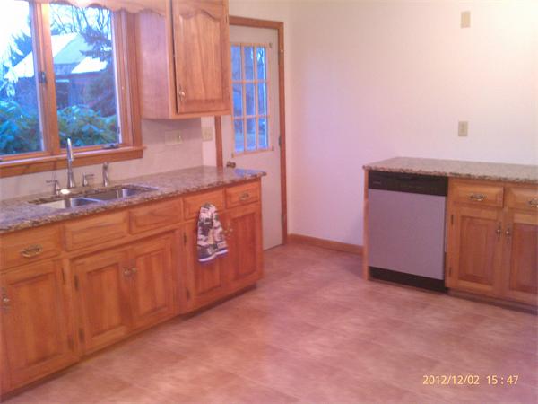 21 State Road Whately, MA 01373 - Photo 6 of 23 a kitchen with granite countertop a sink and a stove