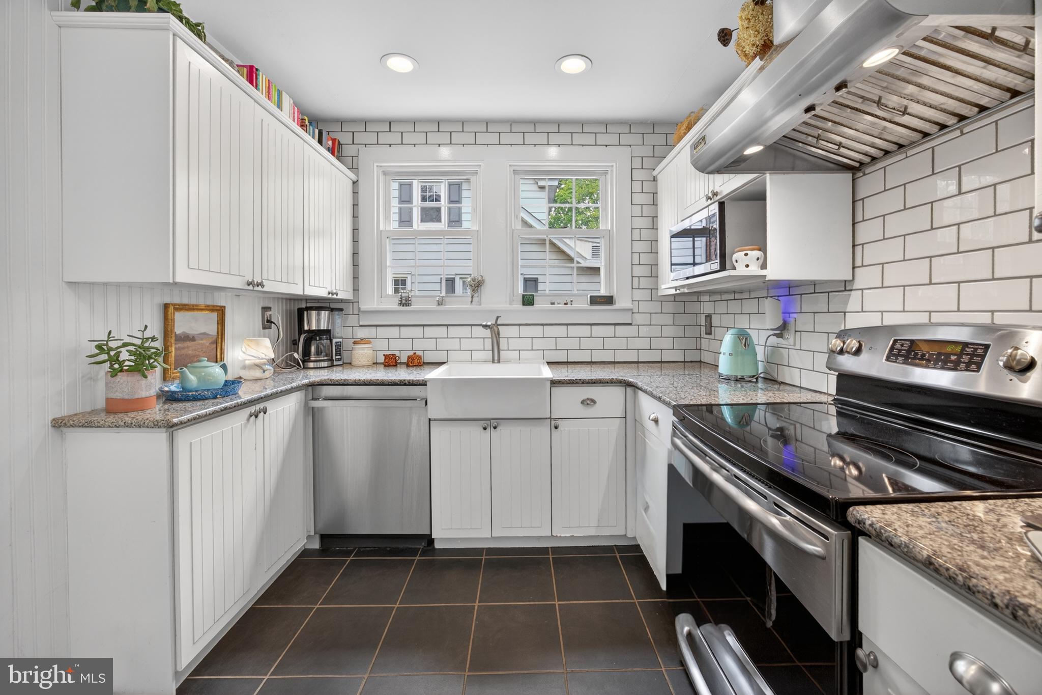 26 Mercer Avenue Doylestown, PA 18901 - Photo 11 of 24 a kitchen with a sink stove and cabinets