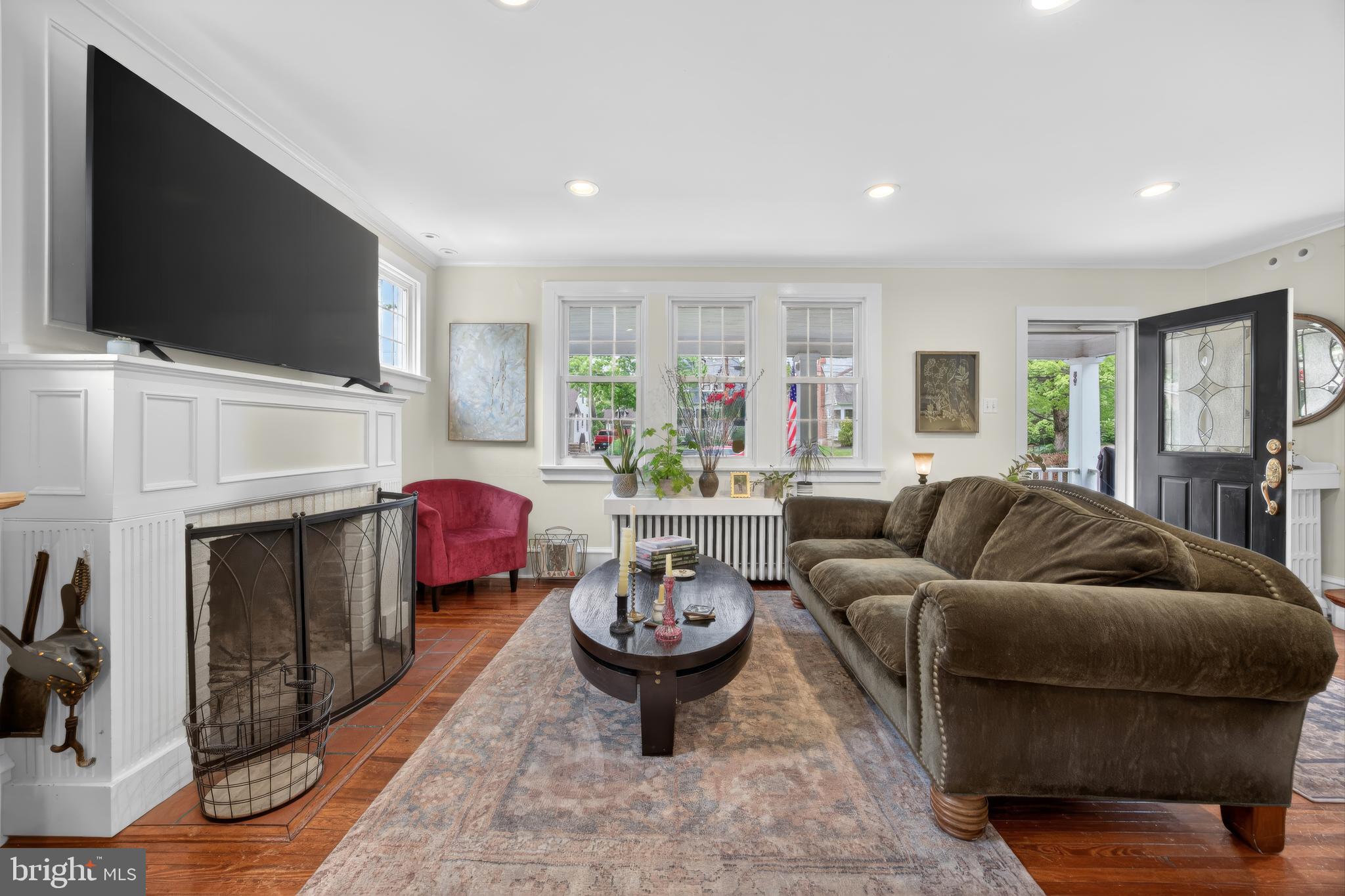 26 Mercer Avenue Doylestown, PA 18901 - Photo 5 of 24 a living room with furniture a flat screen tv and a fireplace