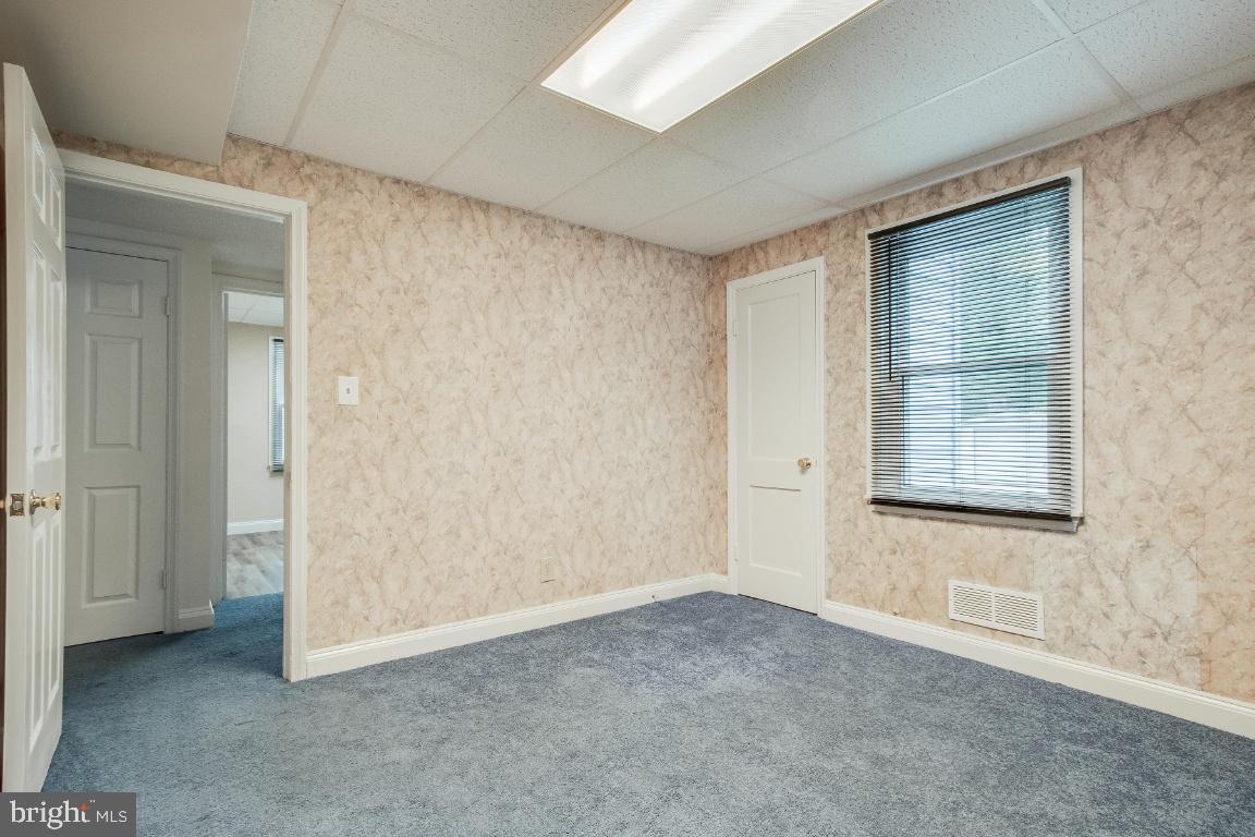 6301 Woodland Road Morningside, MD 20746 - Photo 13 of 32 Lower level bedroom 1 facing hallway