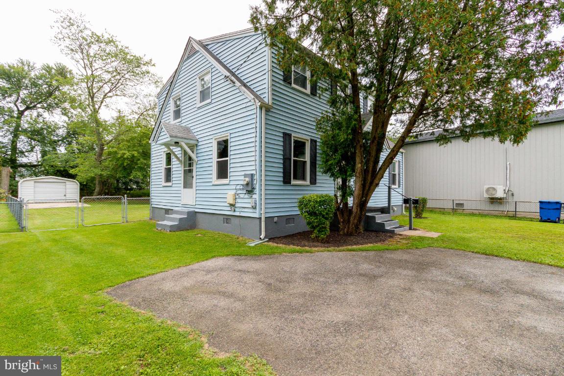 Side Door to right of house. Enters into Stairway.