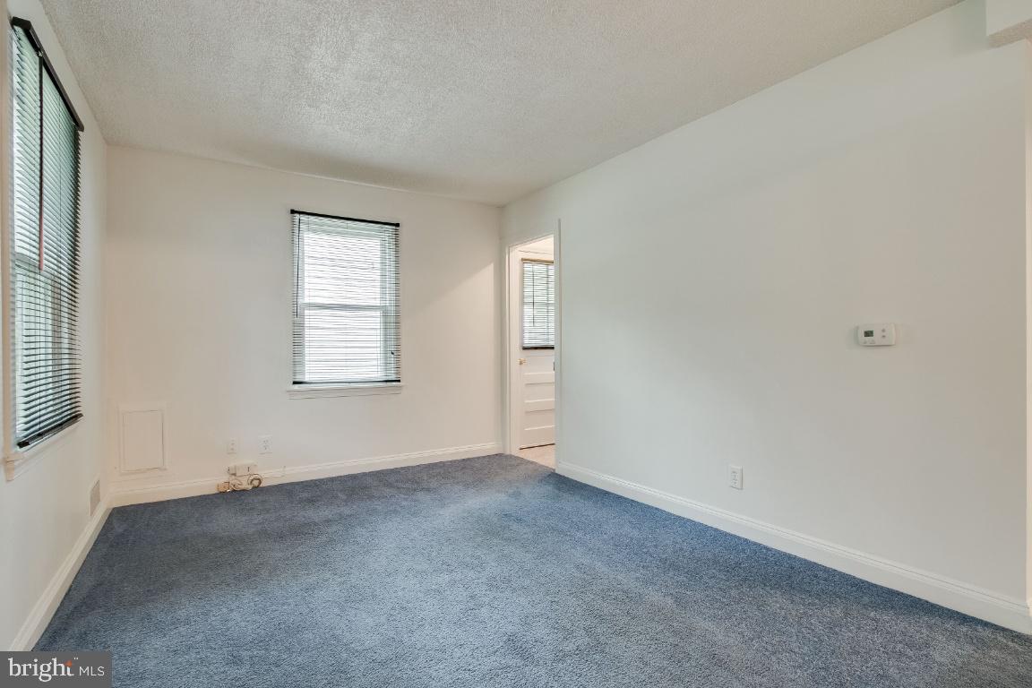 Living room as you enter, side door and stairs
