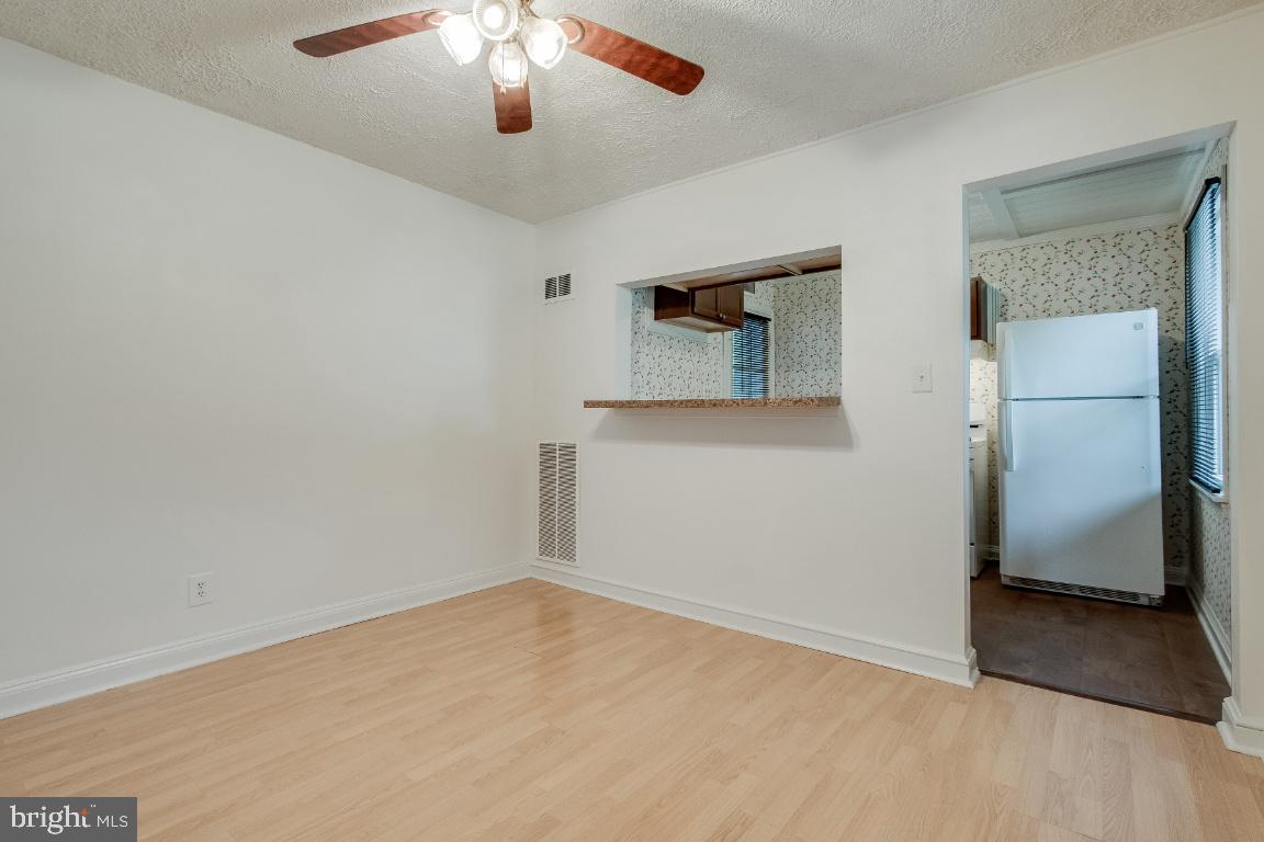 6301 Woodland Road Morningside, MD 20746 - Photo 8 of 32 Dining room and passthrough into kitchen