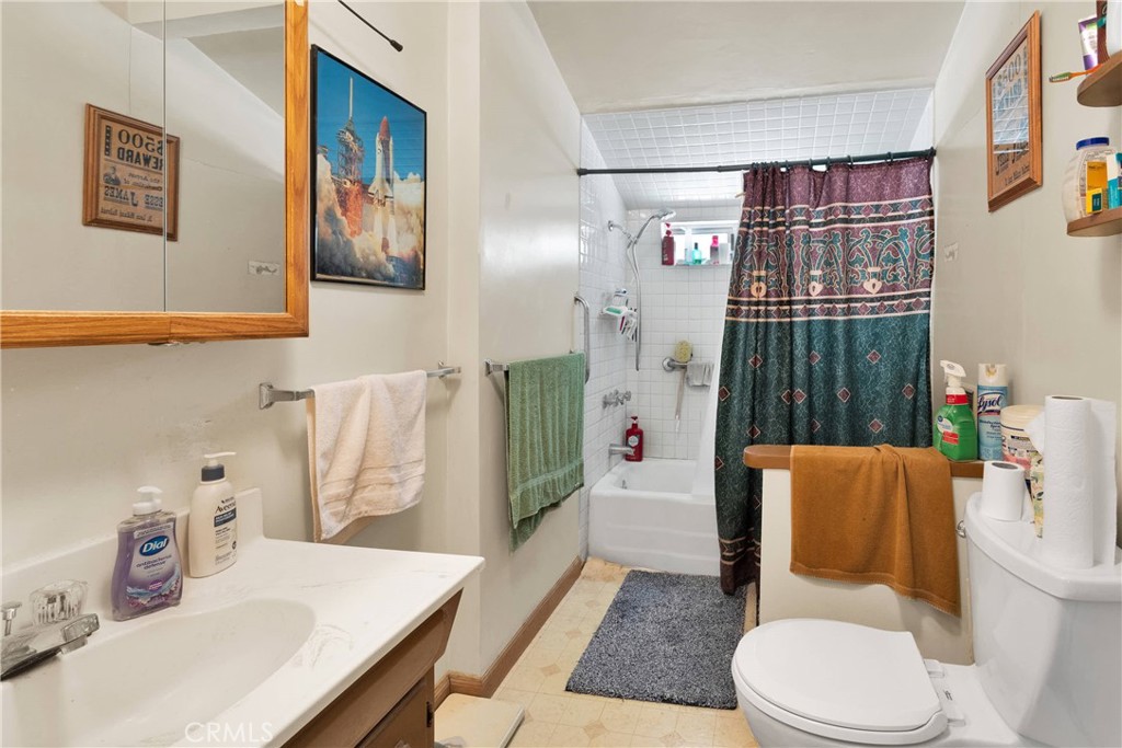 5335 Palmdale Road Phelan, CA 92371 - Photo 15 of 37 a white toilet sitting next to a bathroom sink