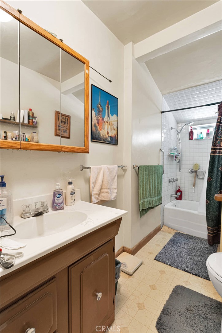 5335 Palmdale Road Phelan, CA 92371 - Photo 16 of 37 a spacious bathroom with a sink a large mirror and a shower