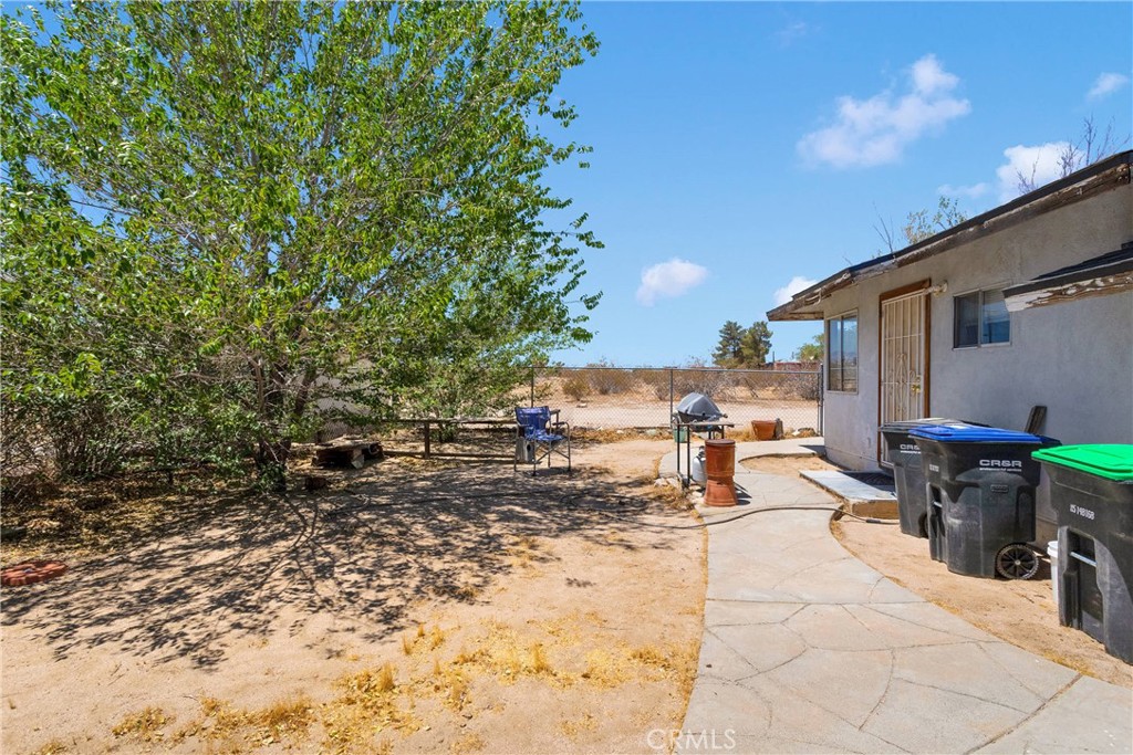 5335 Palmdale Road Phelan, CA 92371 - Photo 24 of 37 a view of a backyard with sitting area