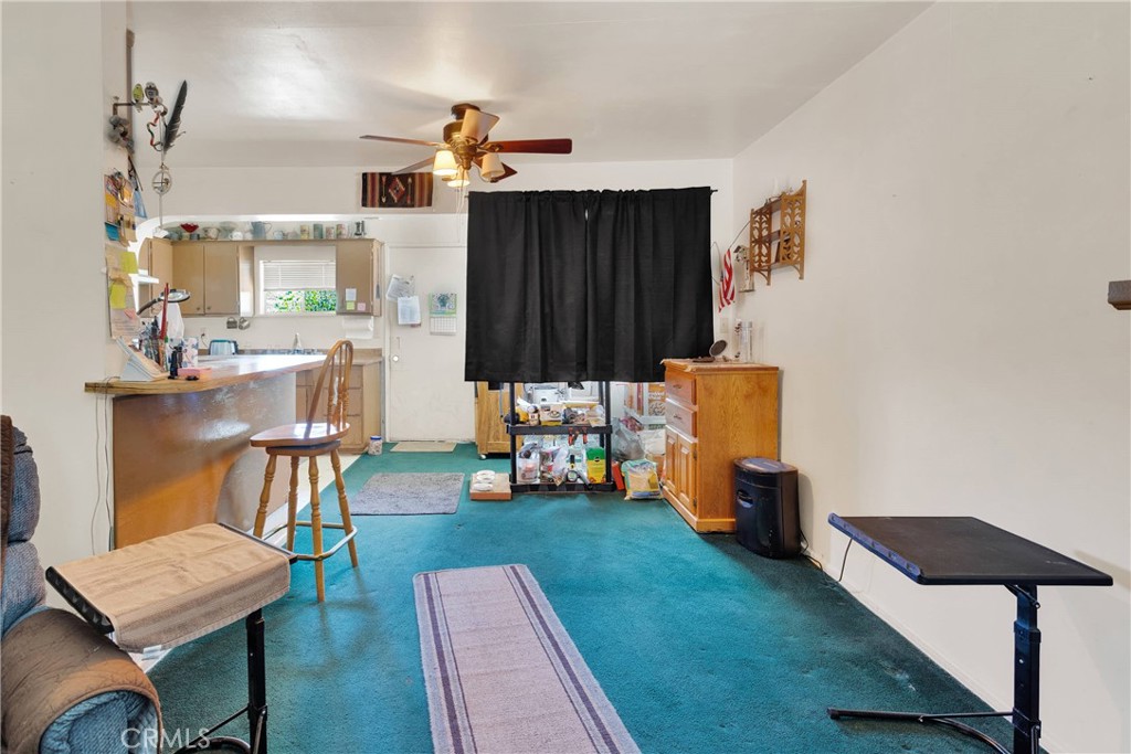 5335 Palmdale Road Phelan, CA 92371 - Photo 7 of 37 a living room with furniture and a gate