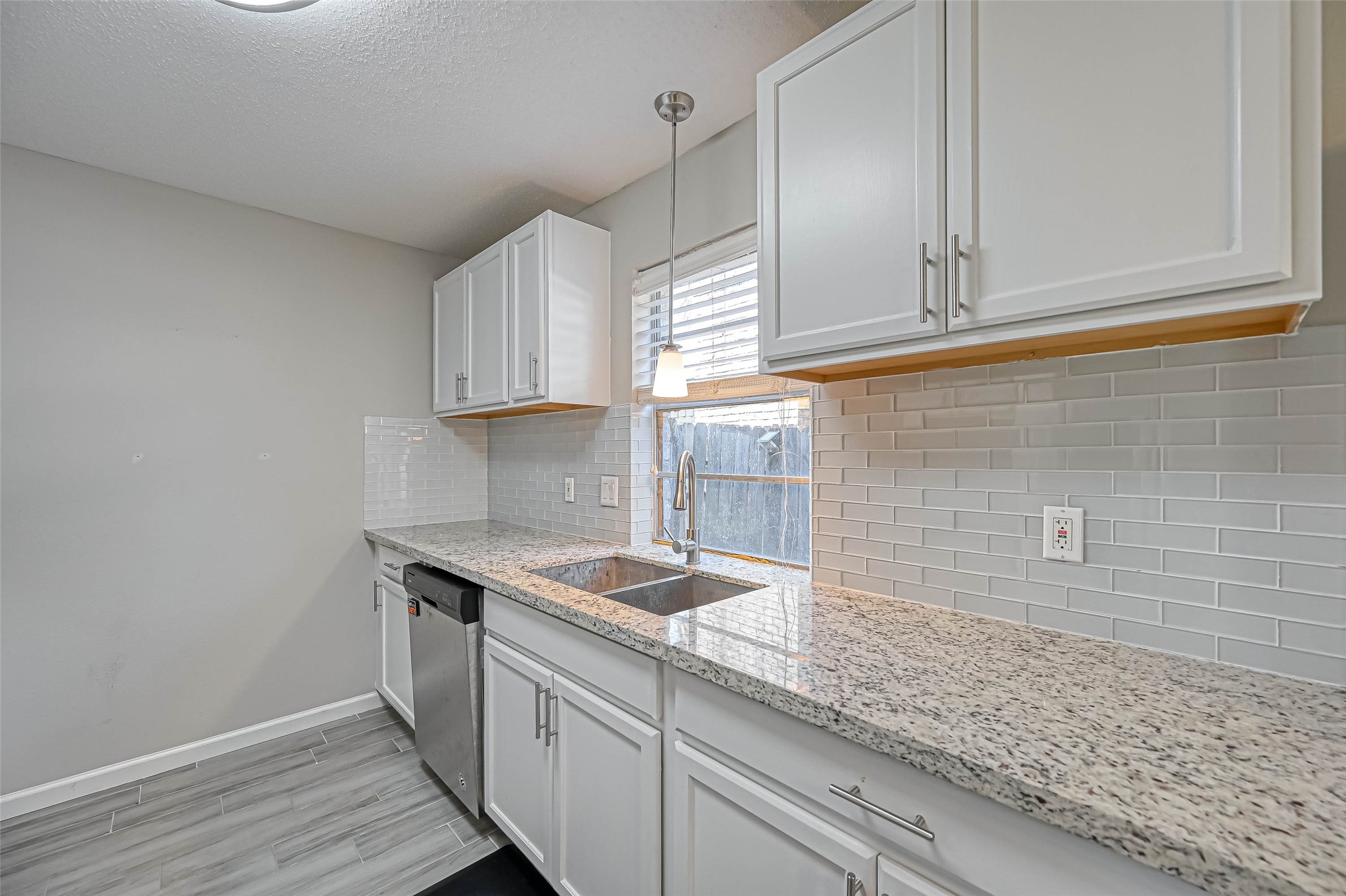 22622 John Rolfe Lane Katy, TX 77449 - Photo 8 of 21 a kitchen with stainless steel appliances granite countertop a sink a stove and cabinets