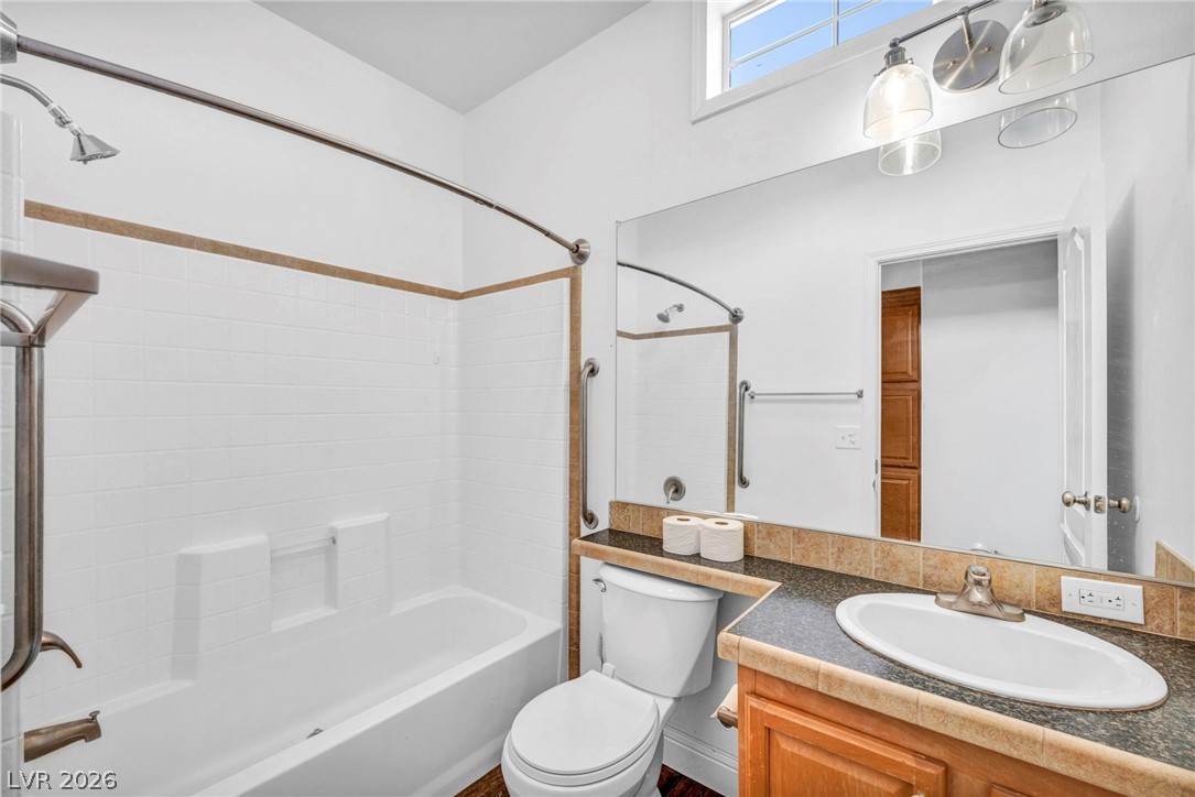 225 California Street Searchlight, NV 89046 - Photo 31 of 64 A refreshed bathroom offers a practical combination bathtub and shower, complemented by a single vanity.