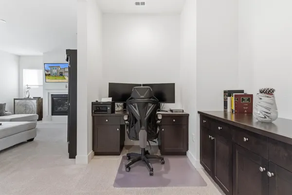 a view of workspace with furniture and wooden floor