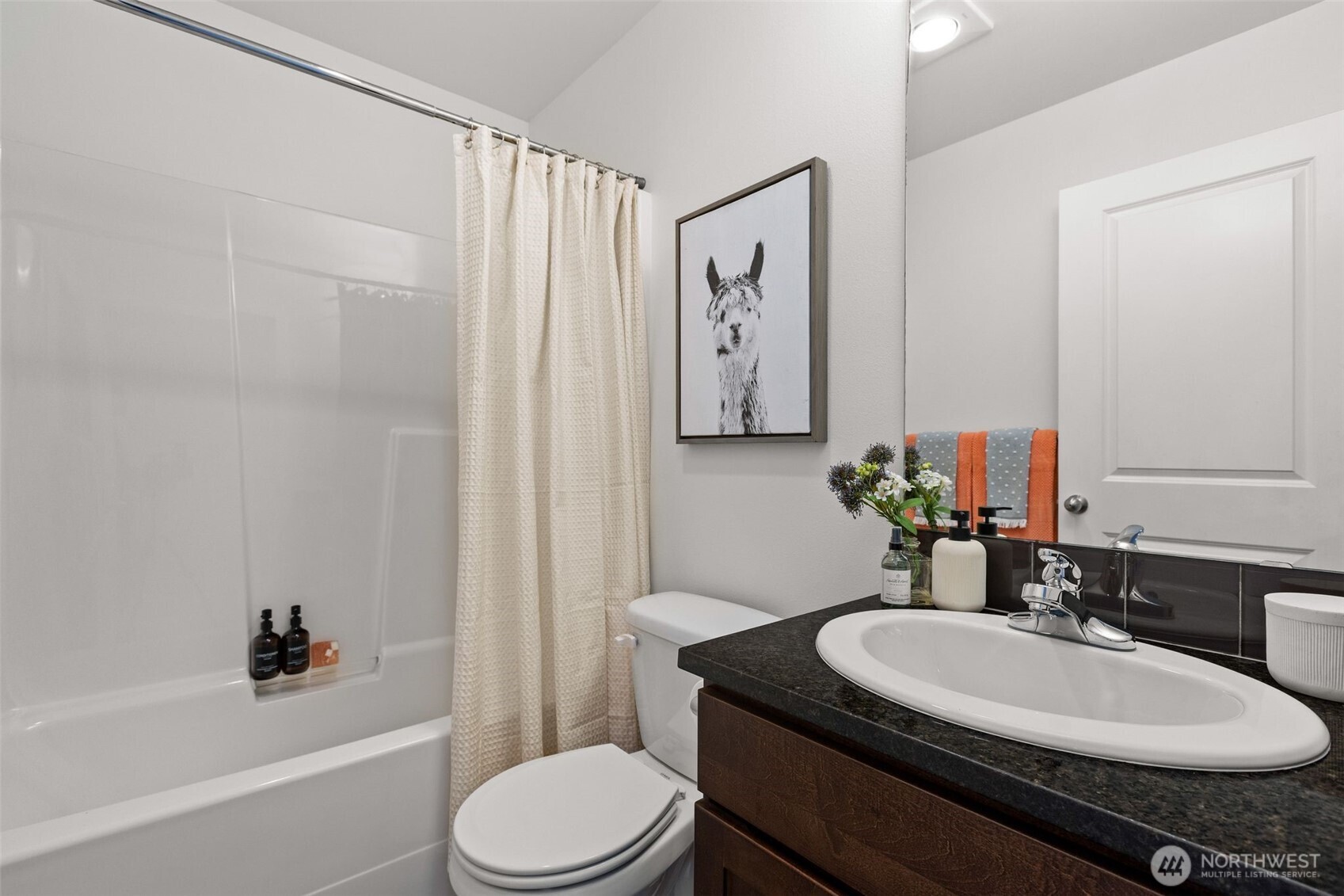 16516 2nd Park Southeast Bothell, WA 98012 - Photo 29 of 39 a bathroom with a granite countertop sink toilet a mirror and shower