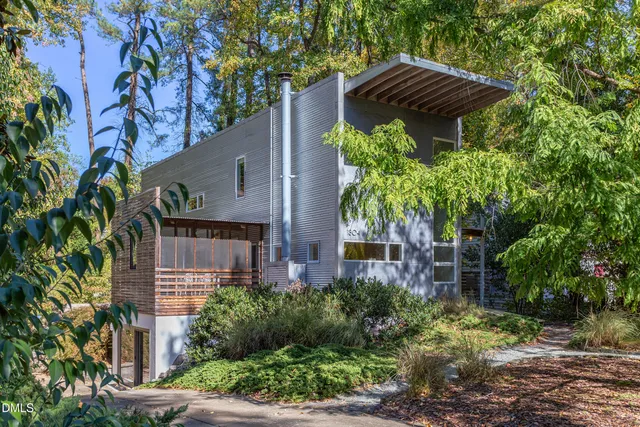 a view of house with a tree in front