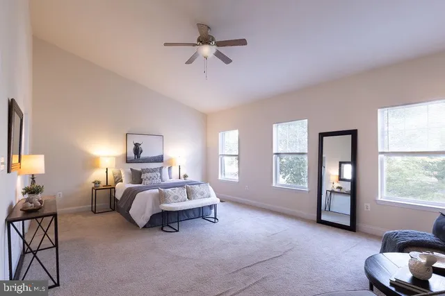 a bed room with a bed and a chair