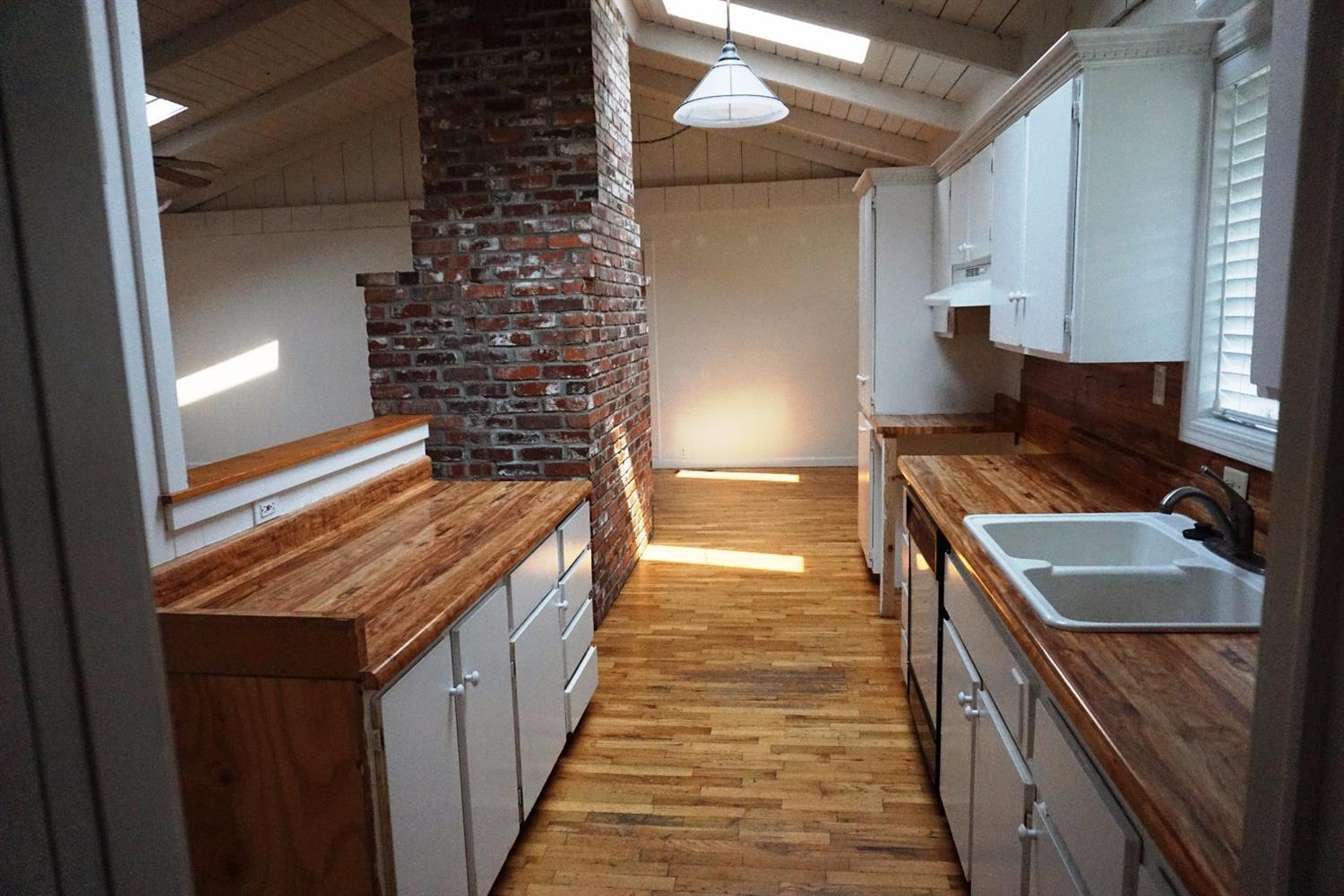 1312 Talent Avenue Talent, OR 97540 - Photo 7 of 21 a kitchen with a stove and a refrigerator