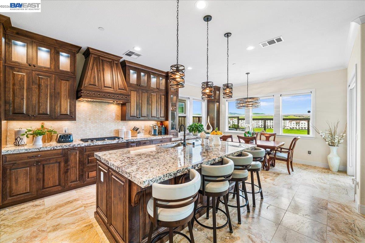 205 Zinnia Court San Ramon, CA 94582 - Photo 11 of 40 a kitchen with granite countertop lots of counter top space and dining table