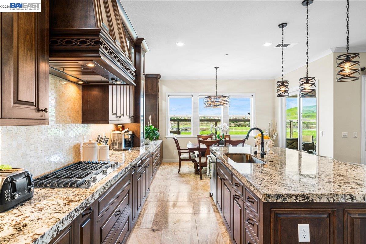 205 Zinnia Court San Ramon, CA 94582 - Photo 12 of 40 a kitchen with sink stove and cabinets